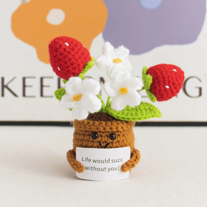 Frutillas y flores tejidas al crochet en maceta